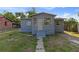Modest single-story home with a neutral-colored exterior and small front lawn at 1224 S Delaware Ave, Deland, FL 32720