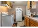 Galley kitchen with tile floors and updated appliances at 1224 S Delaware Ave, Deland, FL 32720