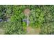 Aerial shot of a small stone bridge traversing a waterway, framed by dense surrounding foliage at 1611 County Road 753S, Webster, FL 33597