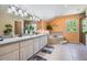Bright bathroom featuring double sinks, a bathtub, and a separate shower at 1611 County Road 753S, Webster, FL 33597