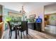 Charming dining area with wood floors and a view of the outdoors, perfect for Gathering meals at 1611 County Road 753S, Webster, FL 33597