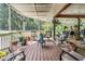 Spacious screened porch with stylish seating and a cozy fire pit at 1611 County Road 753S, Webster, FL 33597