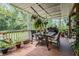 Relaxing covered porch with outdoor dining area and serene views at 1611 County Road 753S, Webster, FL 33597