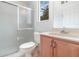 Bathroom featuring a sliding door shower, a toilet, and sink at 239 Beacon Pointe Dr, Ocoee, FL 34761