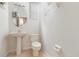 Cozy half bath with a pedestal sink and neutral wall color at 239 Beacon Pointe Dr, Ocoee, FL 34761