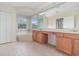 Primary bath offers a double vanity, soaking tub, and separate toilet room at 239 Beacon Pointe Dr, Ocoee, FL 34761