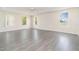 Spacious bedroom with neutral walls, wood-look floors and an abundance of natural light at 239 Beacon Pointe Dr, Ocoee, FL 34761