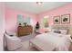 This is a pink bedroom with modern furniture and soft natural light at 239 Beacon Pointe Dr, Ocoee, FL 34761
