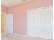 Bedroom featuring a closet with paneled doors and a separate access door at 239 Beacon Pointe Dr, Ocoee, FL 34761
