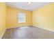 Bright bedroom with sleek wood flooring, a ceiling fan, and a window enhancing the room's cozy ambiance at 239 Beacon Pointe Dr, Ocoee, FL 34761