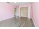 Well-lit bedroom with sleek flooring, a walk-in closet, and connecting door at 239 Beacon Pointe Dr, Ocoee, FL 34761