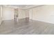 Bright bedroom features wood-look floors and multiple entryways for convenience at 239 Beacon Pointe Dr, Ocoee, FL 34761