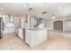 Spacious kitchen featuring an island with white brick veneer and stainless steel appliances at 239 Beacon Pointe Dr, Ocoee, FL 34761