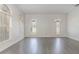 Bright living room showcasing hardwood floors and arched windows at 239 Beacon Pointe Dr, Ocoee, FL 34761