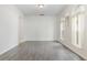 Spacious living room with hardwood floors and arched windows at 239 Beacon Pointe Dr, Ocoee, FL 34761