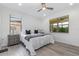 Bright bedroom with a ceiling fan, white walls, and laminate wood flooring, creating a serene atmosphere at 472 Pontevedra Rd, Davenport, FL 33837