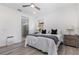 Cozy bedroom featuring a comfortable bed, white walls, and a walk-in shower creating a relaxing retreat at 472 Pontevedra Rd, Davenport, FL 33837