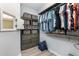 Walk-in closet features built-in storage, shelving, and hanging racks, maximizing organization and convenience at 472 Pontevedra Rd, Davenport, FL 33837