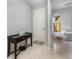 Bright foyer with tile flooring, featuring a console table and view into the living area at 472 Pontevedra Rd, Davenport, FL 33837
