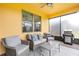 Relaxing outdoor patio seating area with grill, ceiling fan, and sliding door access to the indoors at 472 Pontevedra Rd, Davenport, FL 33837