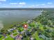 Aerial view showing location of waterfront home in a scenic residential neighborhood at 718 Cr 467, Lake Panasoffkee, FL 33538