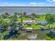 Aerial view showing the canal-front homes and lake view in this waterfront neighborhood at 718 Cr 467, Lake Panasoffkee, FL 33538