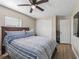 Spacious bedroom features wood-look flooring and a closet at 718 Cr 467, Lake Panasoffkee, FL 33538