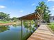 Wooden boat dock with shelter, canal access, space for seating and relaxation at 718 Cr 467, Lake Panasoffkee, FL 33538