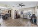Spacious room with wood floors, an office with a computer, and dining room with a wood table at 718 Cr 467, Lake Panasoffkee, FL 33538