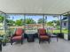 Relaxing screened patio with comfortable seating and peaceful view at 718 Cr 467, Lake Panasoffkee, FL 33538