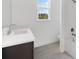 Bright bathroom featuring a single vanity with ample counter space and tiled shower/tub combo at 12898 Harvest Rain Ave, Winter Garden, FL 34787
