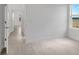 Bright, spacious bedroom with wood-look floors, white walls, and plenty of natural light at 12898 Harvest Rain Ave, Winter Garden, FL 34787