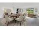 Open-concept home featuring dining area that flows into the kitchen and living room at 12898 Harvest Rain Ave, Winter Garden, FL 34787