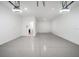 Spacious three car garage with an epoxy floor and ample lighting at 12898 Harvest Rain Ave, Winter Garden, FL 34787