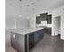 Modern kitchen with gray cabinets, stainless steel appliances, and wine cooler at 12898 Harvest Rain Ave, Winter Garden, FL 34787
