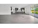 Open-concept kitchen featuring gray cabinetry, a spacious island, and an adjacent dining area, perfect for gatherings at 12898 Harvest Rain Ave, Winter Garden, FL 34787