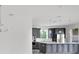 Modern kitchen features gray cabinets, stainless steel appliances, and a center island at 12898 Harvest Rain Ave, Winter Garden, FL 34787