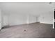 Expansive living room with neutral walls and floors, ideal for versatile interior design at 12898 Harvest Rain Ave, Winter Garden, FL 34787