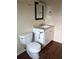 Functional bathroom with a toilet, vanity, and neutral decor; a clean and practical space at 2915 Winter Lake Rd, Lakeland, FL 33803