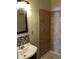 Updated bathroom featuring a modern sink and tiled shower with neutral color palette at 2915 Winter Lake Rd, Lakeland, FL 33803
