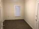 Simple, carpeted bedroom with a window and fresh paint, ready for personalization at 2915 Winter Lake Rd, Lakeland, FL 33803