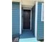 Blue exterior with a black front door and a small ramp at 2915 Winter Lake Rd, Lakeland, FL 33803