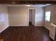 A spacious living area with hardwood floors and access to multiple rooms at 2915 Winter Lake Rd, Lakeland, FL 33803
