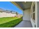 Backyard featuring privacy fence, grass, and mulch with a view from the covered patio at 5920 Bristle Oak St, Mount Dora, FL 32757