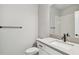 Contemporary bathroom featuring white vanity with stone countertop, toilet, and tiled shower at 5920 Bristle Oak St, Mount Dora, FL 32757