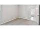 Neutral bedroom showcasing carpeting, view into hallway, and white baseboards at 5920 Bristle Oak St, Mount Dora, FL 32757