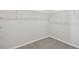 Neutral colored, carpeted walk-in closet showcasing wire shelving system for optimal organization at 5920 Bristle Oak St, Mount Dora, FL 32757