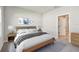 A well-lit main bedroom features stylish decor and a coordinated color scheme for a relaxing retreat at 5920 Bristle Oak St, Mount Dora, FL 32757