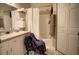 Well-lit bathroom features ample counter space, complemented by a convenient shower-tub combo at 6300 Raleigh St # 102, Orlando, FL 32835