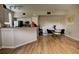 Open-concept living space showcasing a modern dining set and breakfast bar, perfect for entertaining guests at 6300 Raleigh St # 102, Orlando, FL 32835